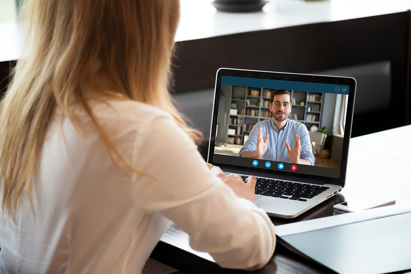 Man on a virtual video call on a laptop computer screen. 